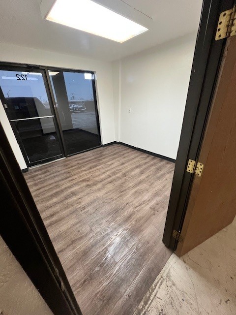 Unit 122 flex space with clean white-box finish